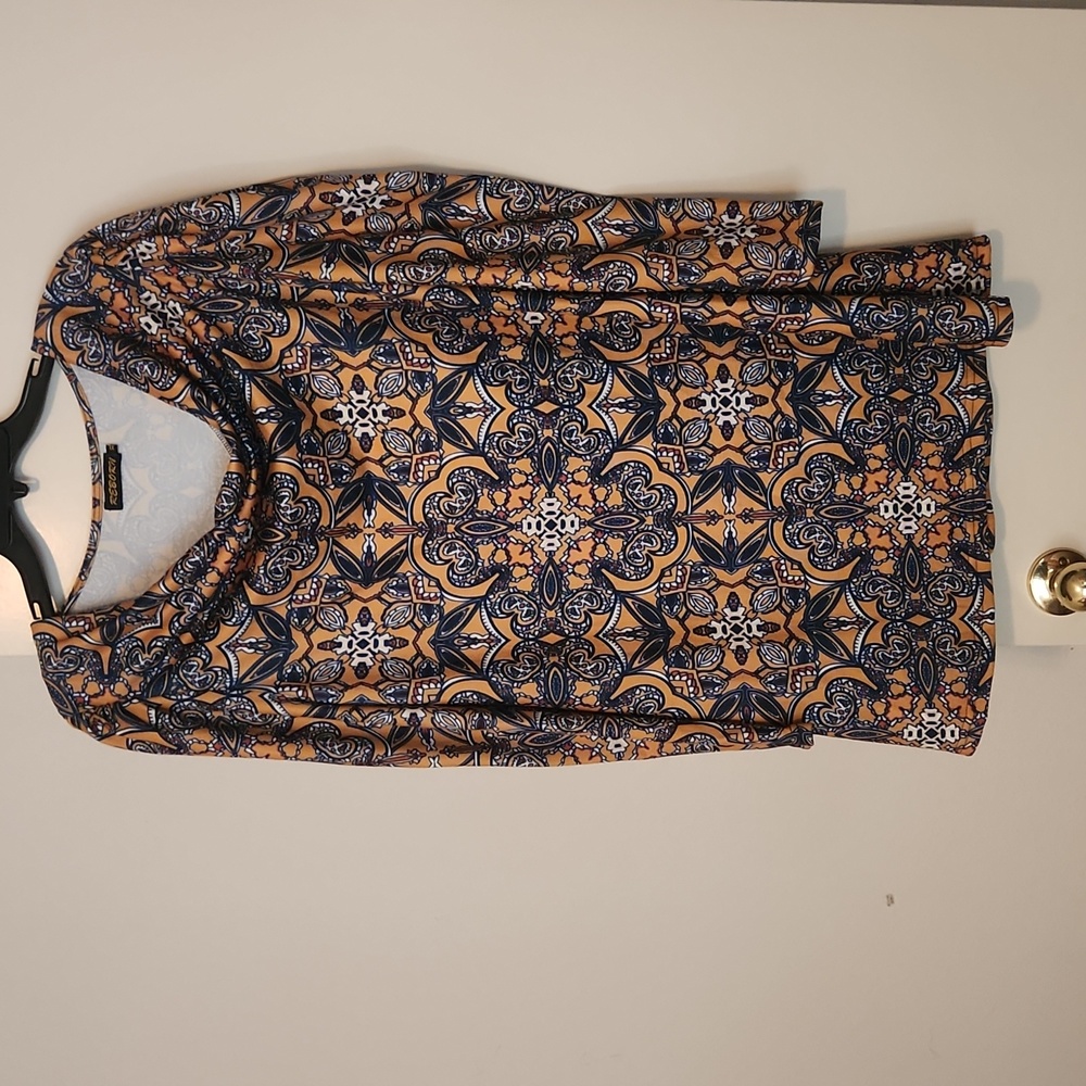 XL long sleeve knit tunic. Mustard and black multi colored print.
